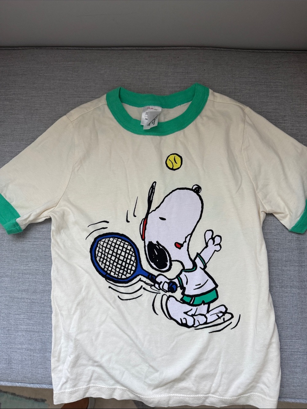 Hannah Andersson Peanuts Cream Tee with Green Trim and Snoopy Tennis Graphic